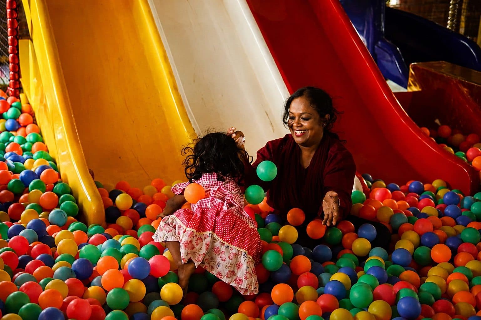 Mother and child in the ball pit