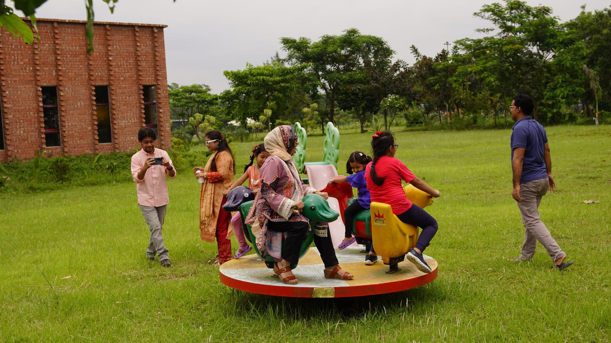 Families gathered at the garden merry-go-round