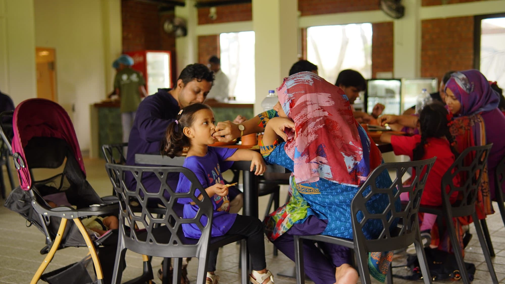 Families dining in the hall