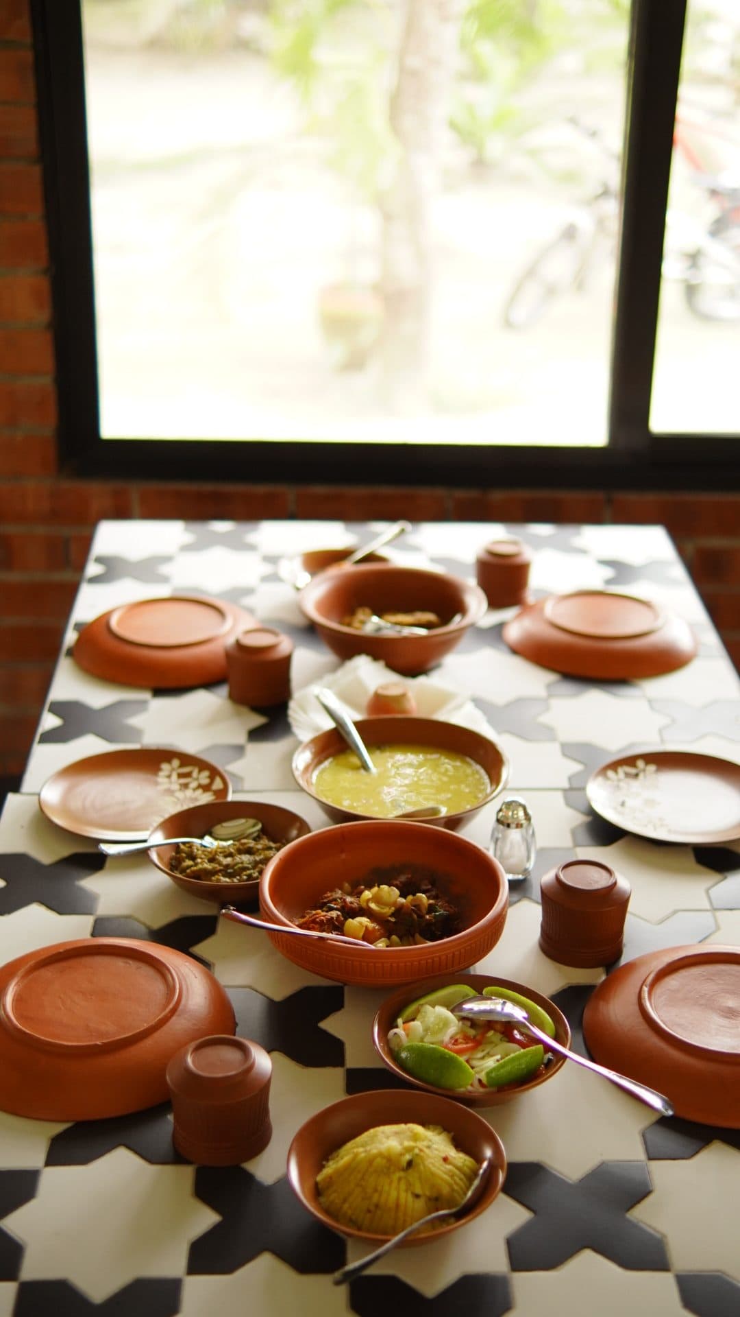 Clay-pot thali by the window