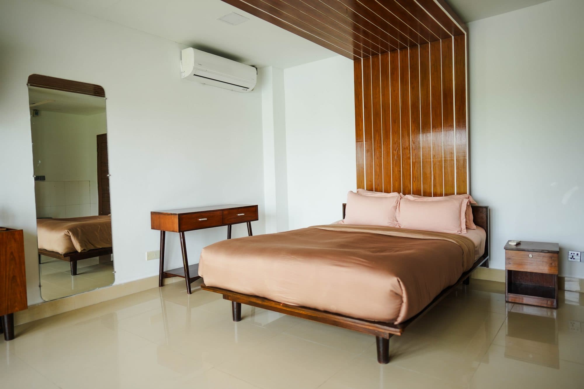 Garden room interior with wood headboard