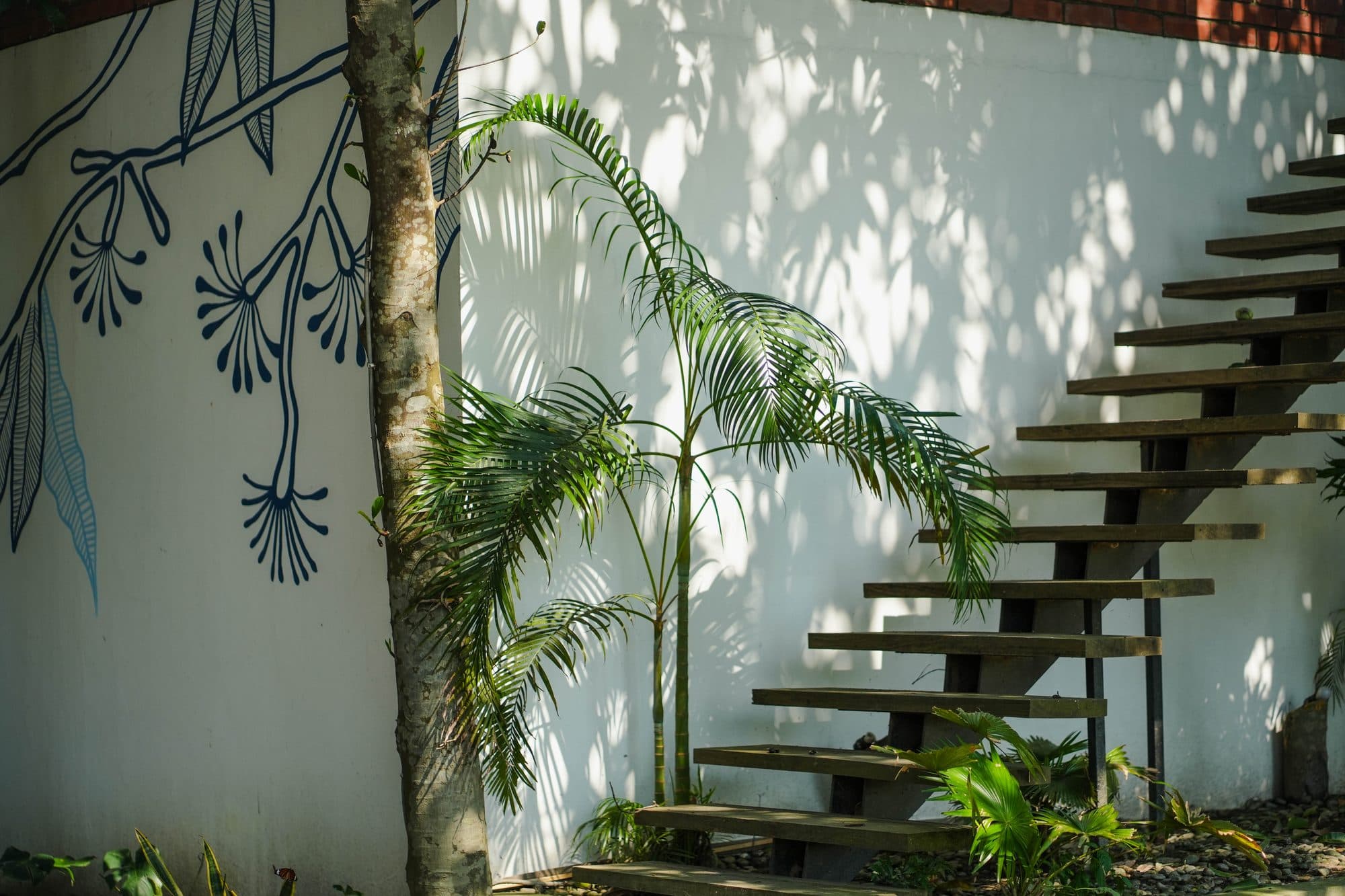Botanical mural and floating staircase